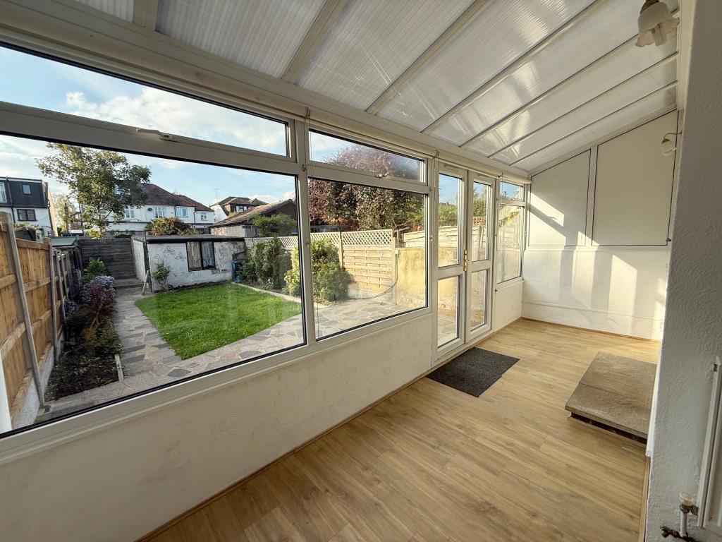 Lot: 59 - THREE-BEDROOM HOUSE FOR REPAIR AND IMPROVEMENT - Conservatory overlooking rear garden